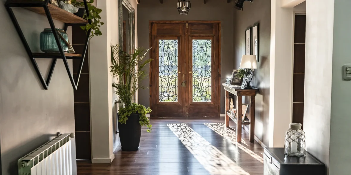 View of the fancy wooden front door from inside the house