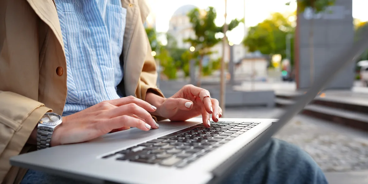 woman working on laptop outside