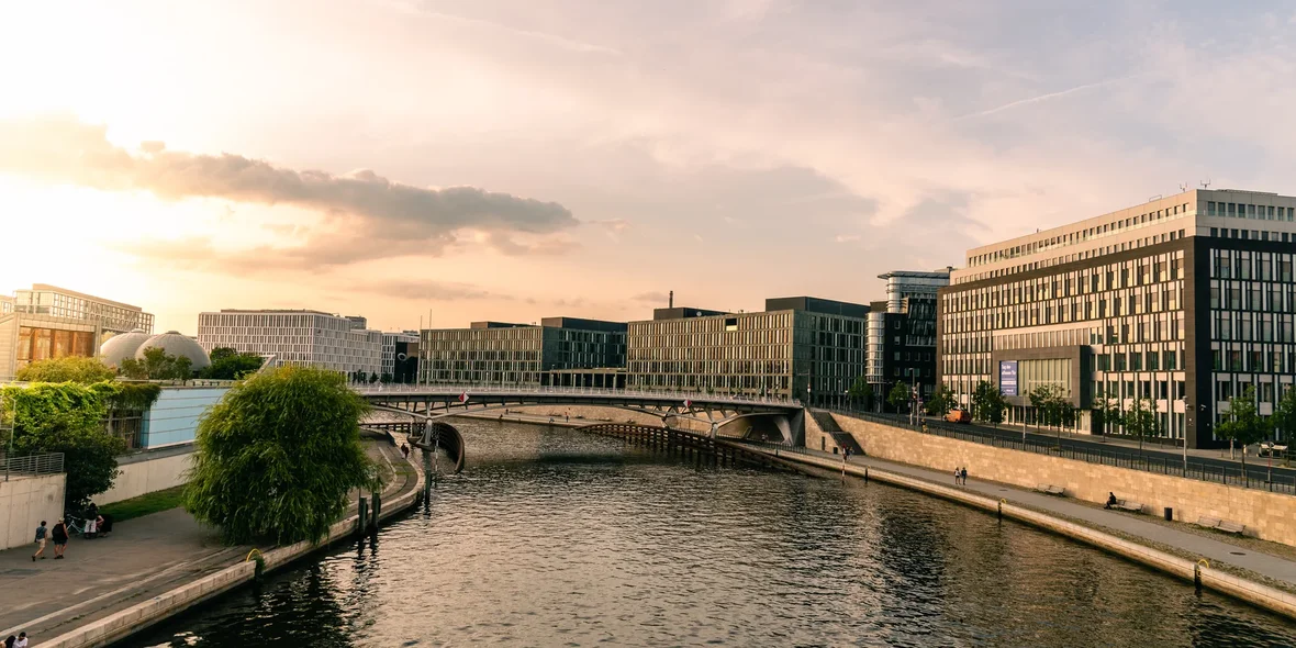 Panoramic view of modern office buildings on the banks of the Spree River in Berlin at sunset