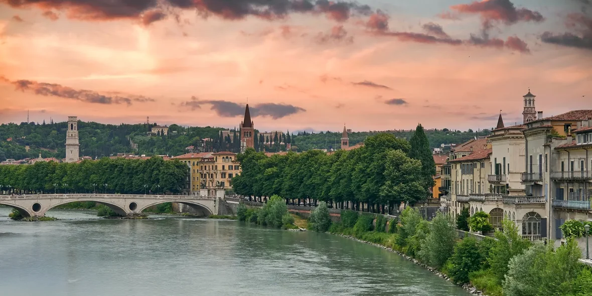 Cityscape with dramatic sky over river in Verona, Italy