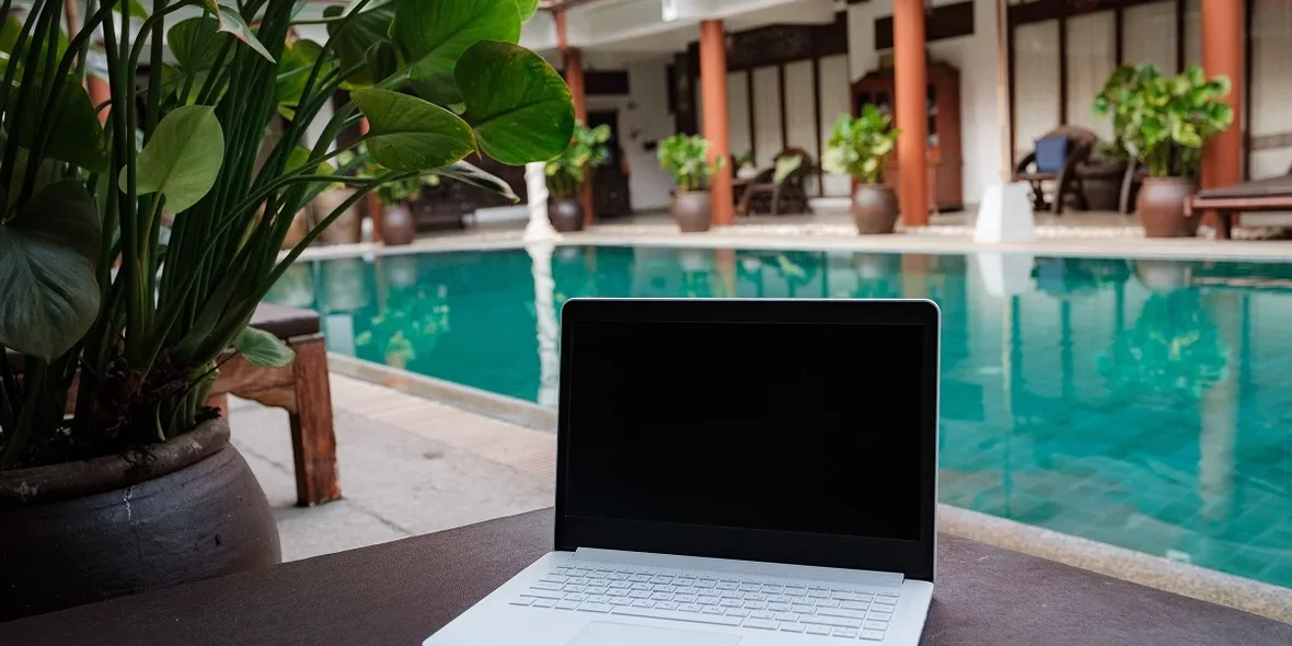 Laptop on the pool table, the concept of remote work