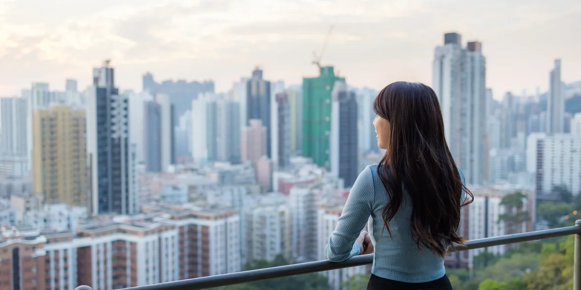 A woman looks at the city