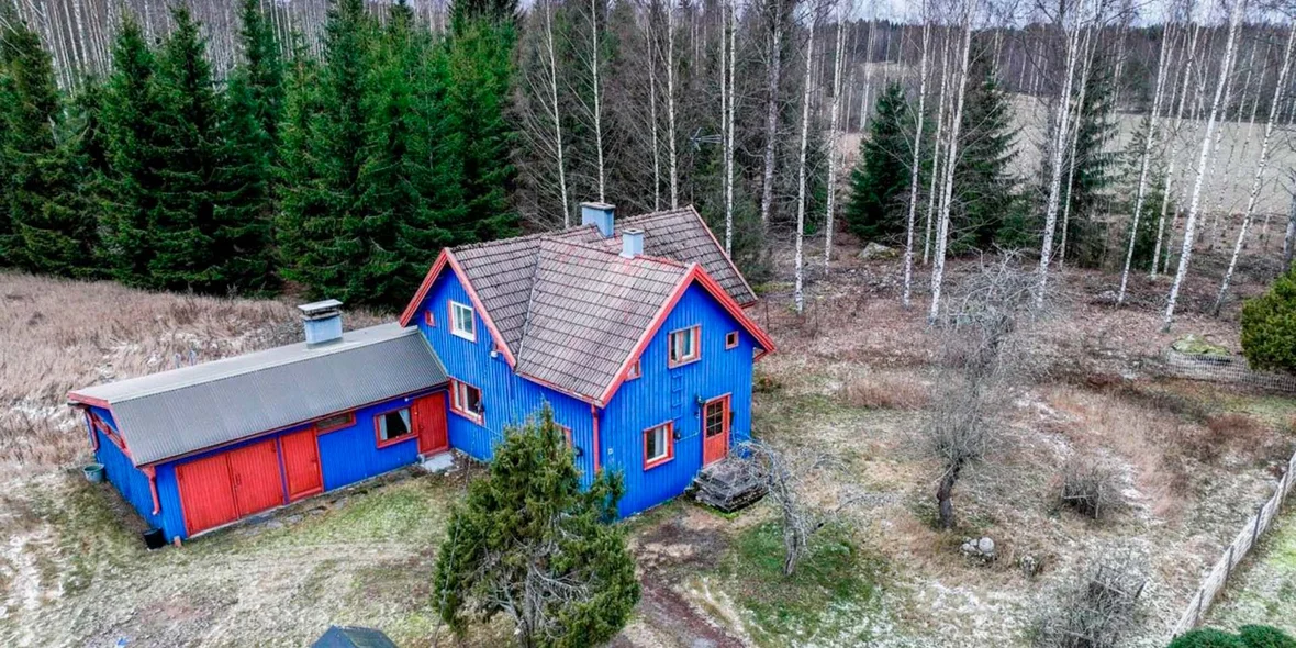 Wooden house painted in red and blue