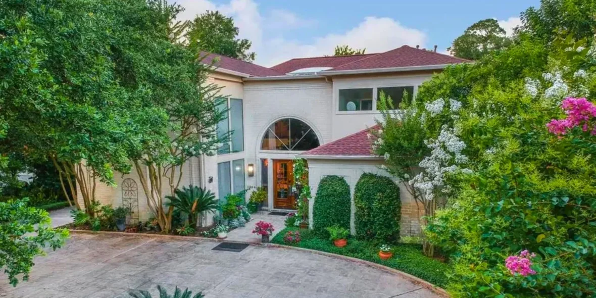 The facade and main entrance of the River Oaks home