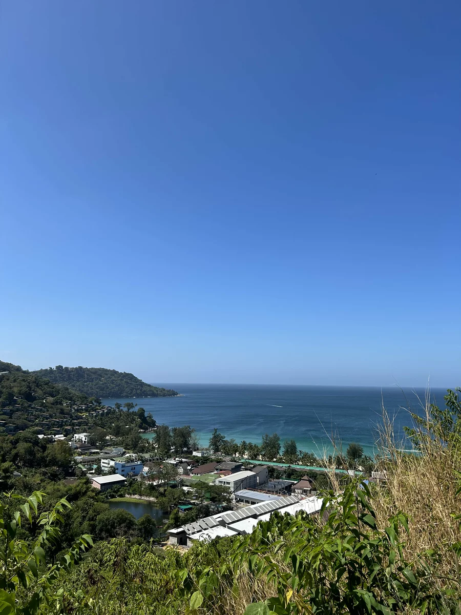 an aerial view of the houses and the ocean