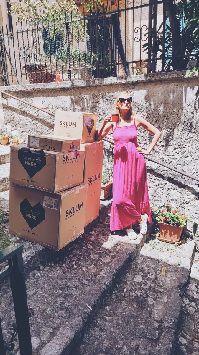 A woman with boxes in Italy