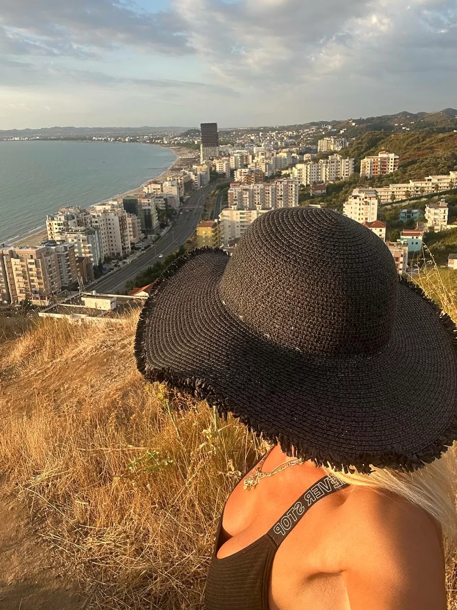 a girl looking at the development of Albania from above