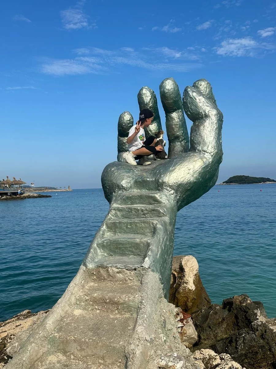 a large hand in the form of a sculpture in Albania