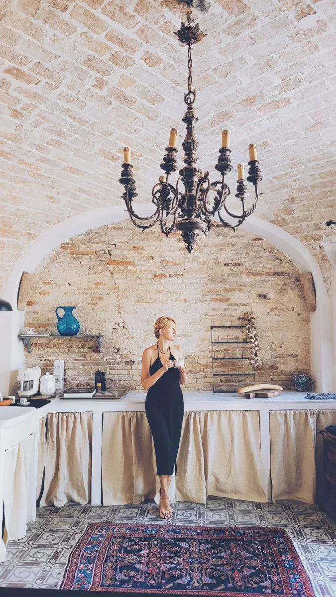 A woman drinking coffee in the house