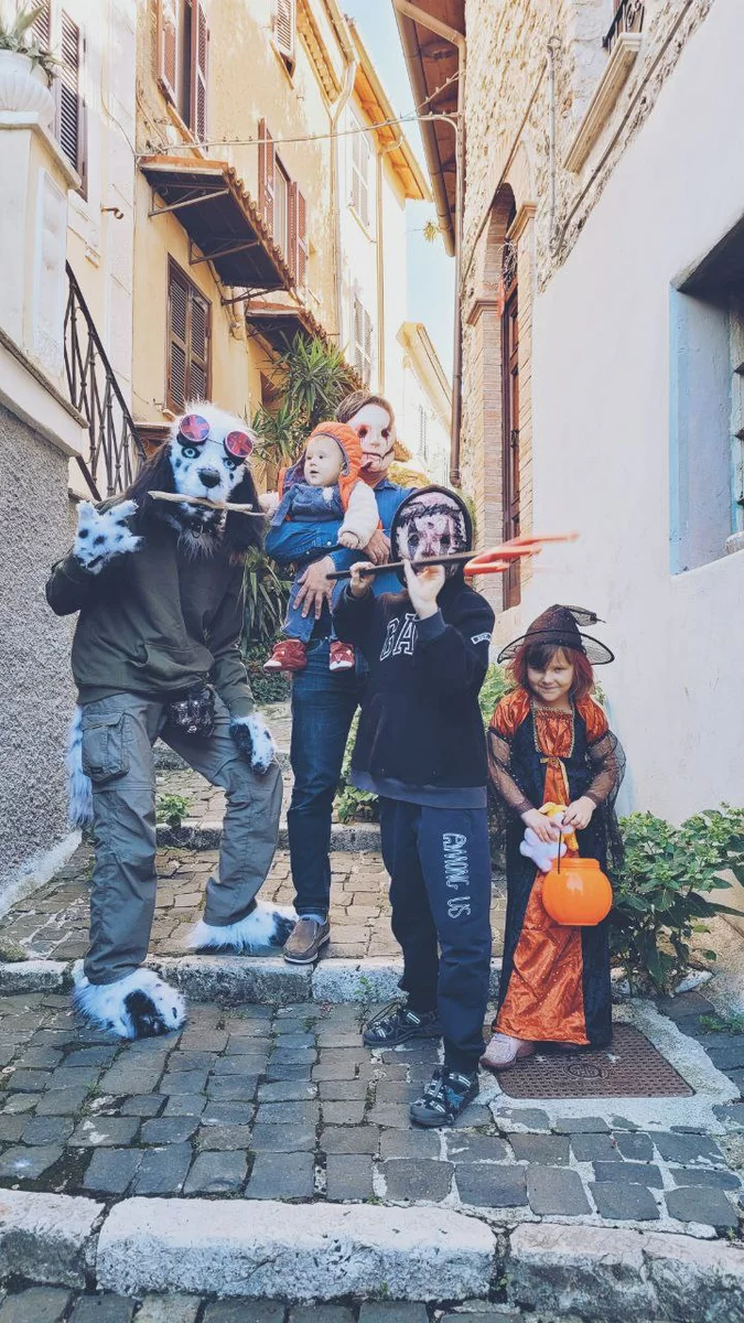 Big family in Halloween outfits.