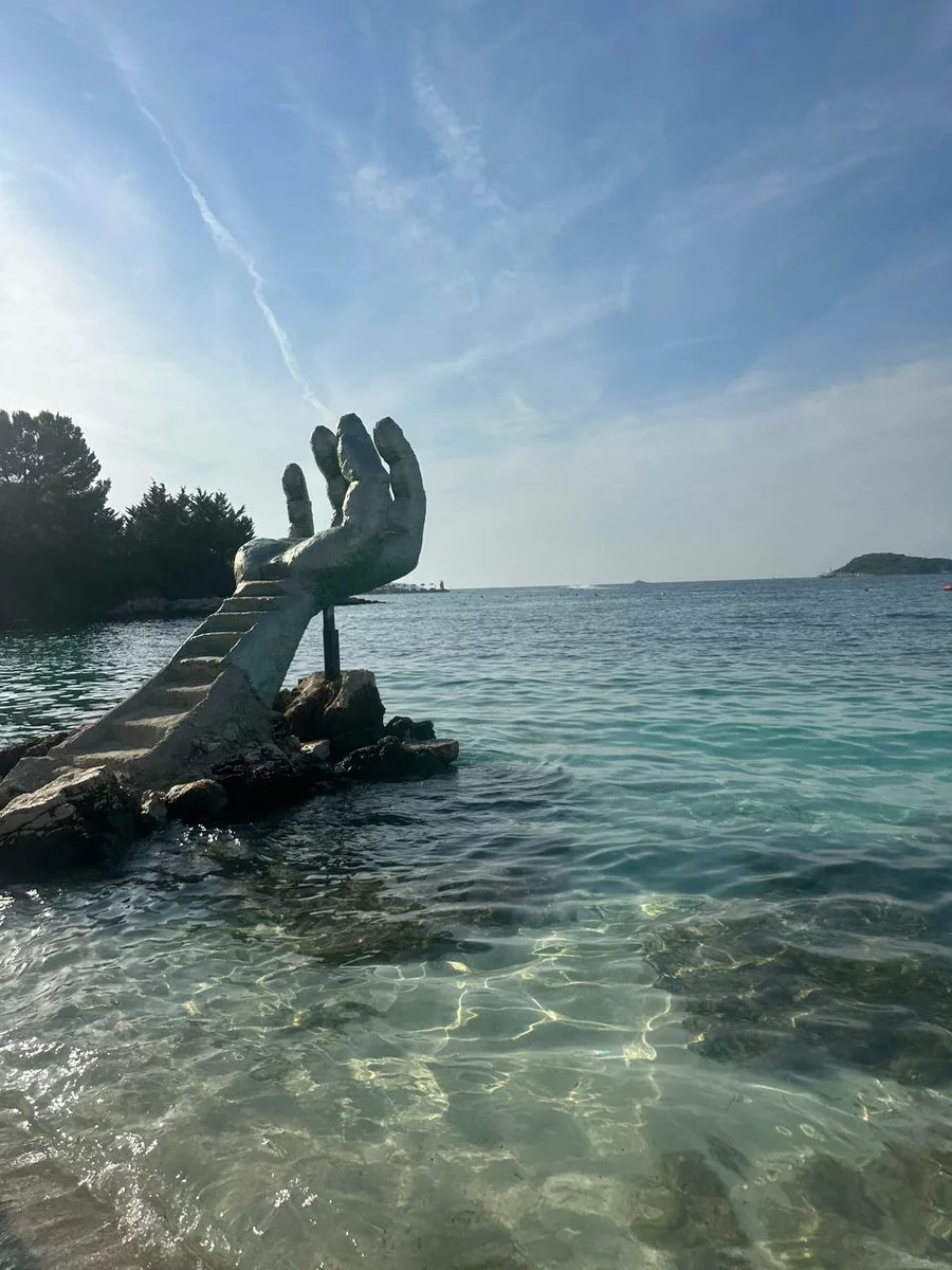 a ladder in the shape of a big hand in Albania