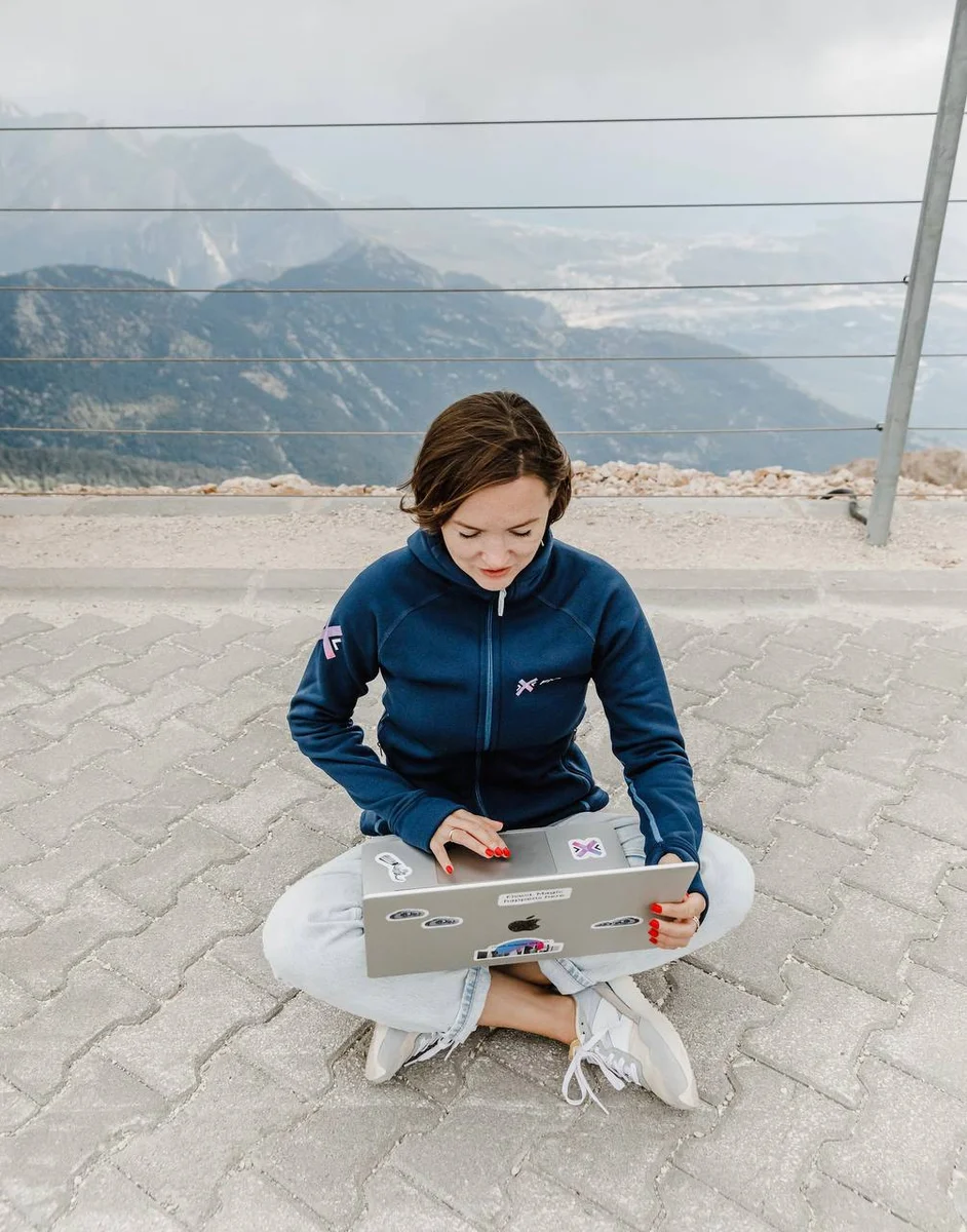 a girl working on a laptop 