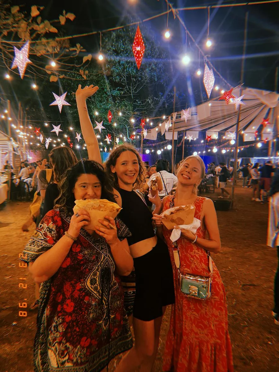three girls with street food in India