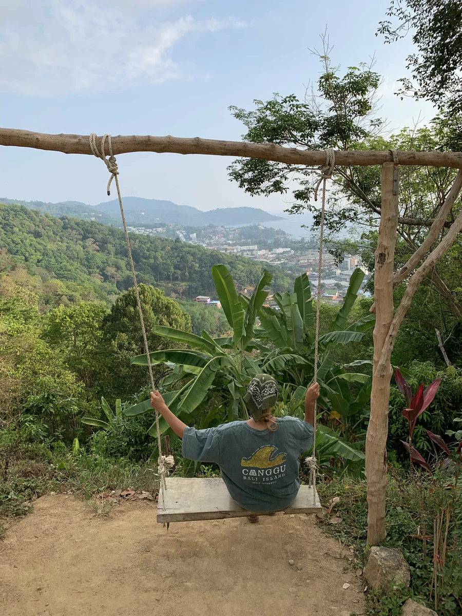 girl on a swing in the thicket