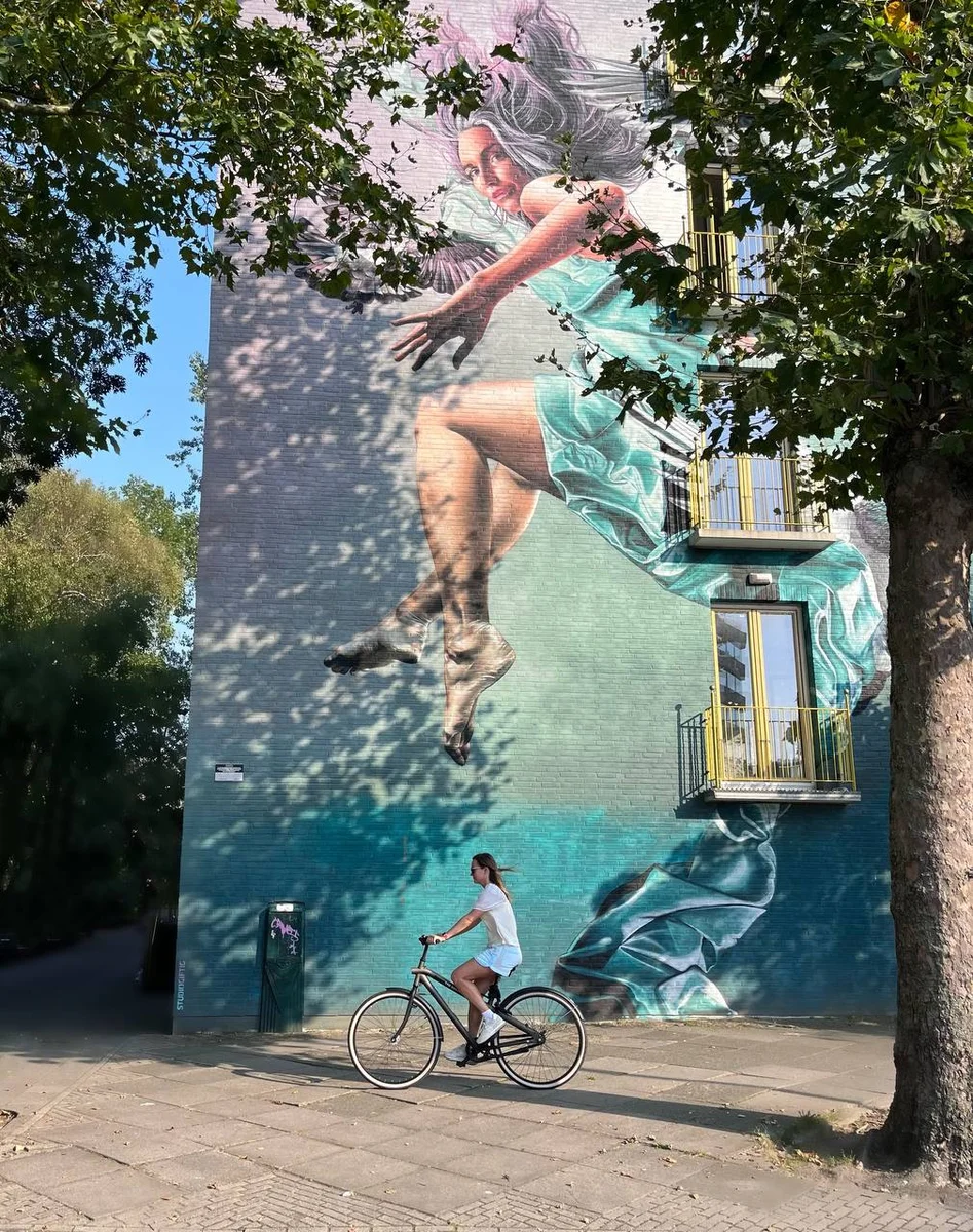 a girl on a bicycle on the streets of the Netherlands 