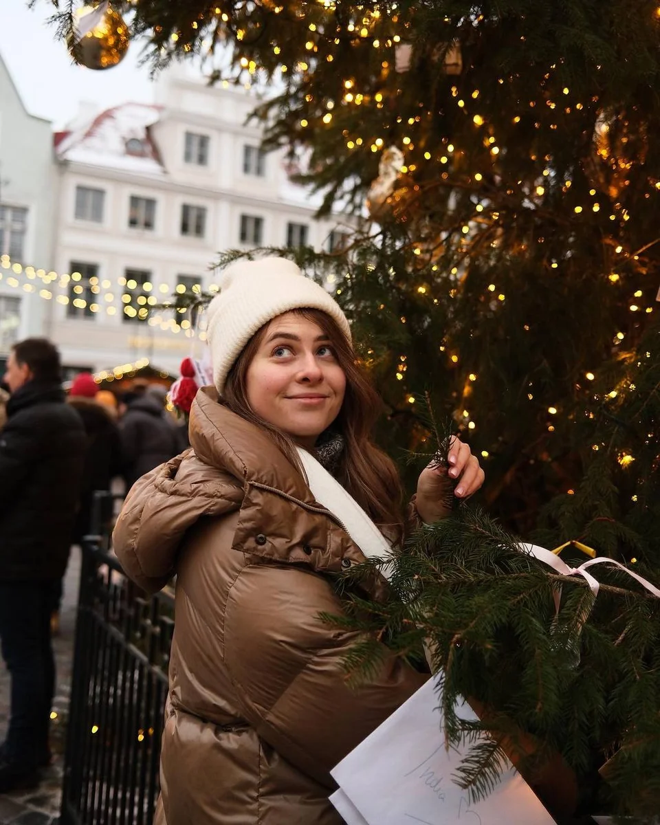 girl next to the Christmas tree