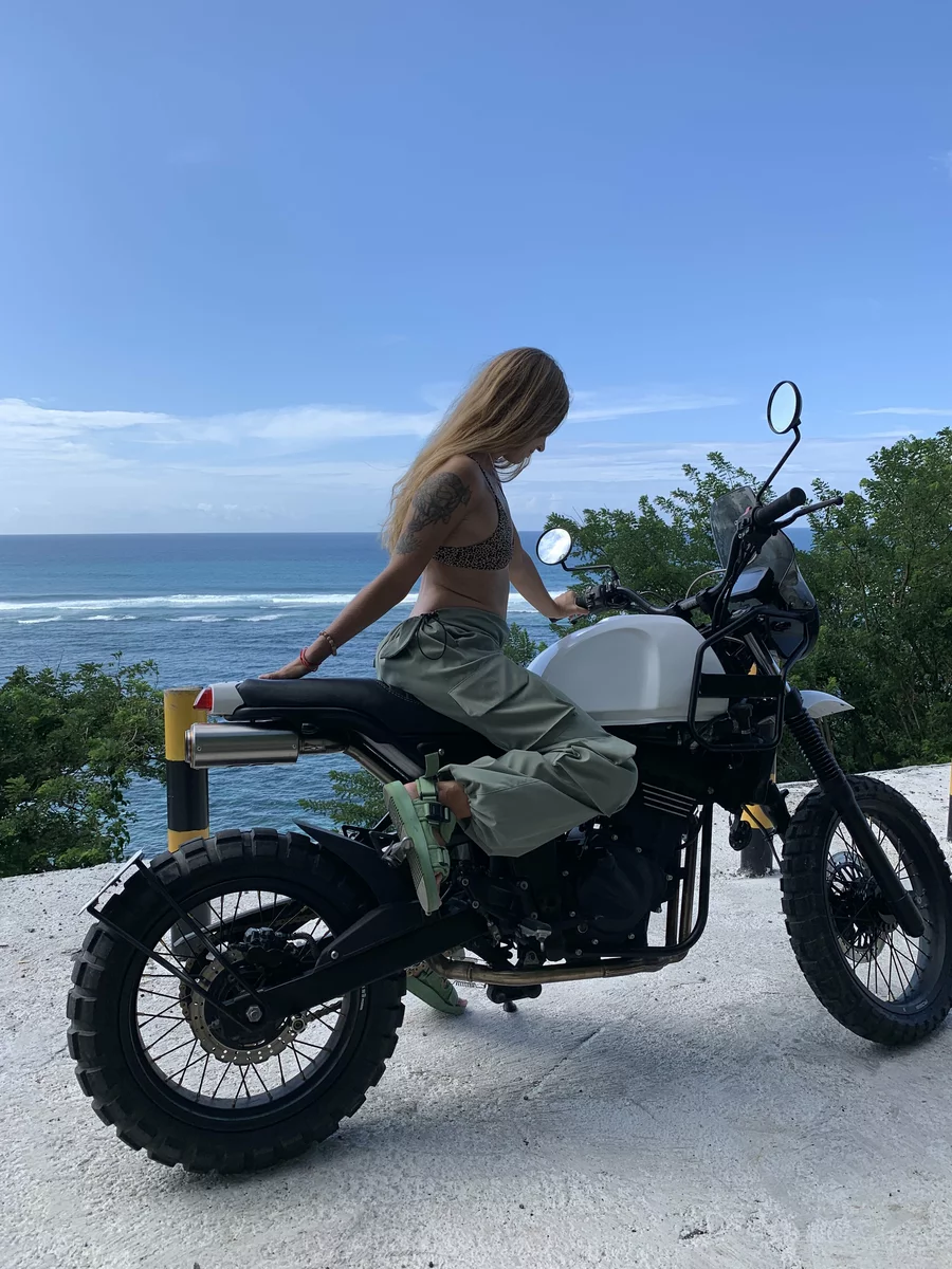 Victoria on a motorcycle, photo overlooking the ocean