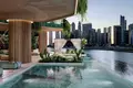 Wohnkomplex New residence Eywa with swimming pools, lounge areas and waterfalls on the bank of the canal, Business Bay, Dubai, UAE