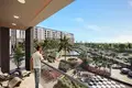 Residential complex Rukan Tower Residence with a swimming pool and gardens, Dubai Land, Dubai, UAE