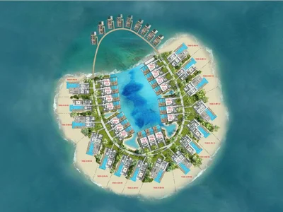 Residential complex German style villas next to the beach and lagoon, The World Islands, Dubai, UAE