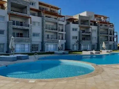 Apartment building EG-113 Soma Breeze is a tranquil beachfront community at the tip of Soma Bay