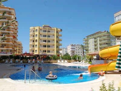 Residential quarter Beautiful centric Apartment with large pool close to the beach