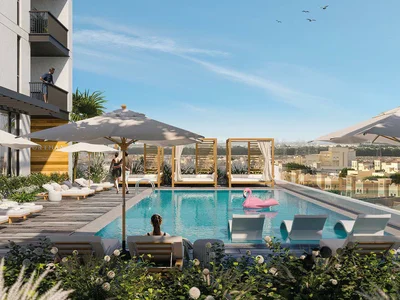Complexe résidentiel The Portman residential complex with a swimming pool and lounge areas close to Burj Khalifa and Dubai Marina, JVC, Dubai, UAE