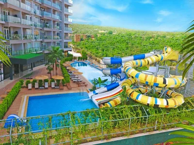 Zespół mieszkaniowy Residence with swimming pools, an aquapark and a mini golf course at 80 meters from the sea, Mersin, Turkey