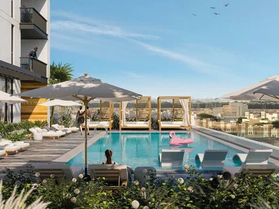 Zespół mieszkaniowy The Portman residential complex with a swimming pool and lounge areas close to Burj Khalifa and Dubai Marina, JVC, Dubai, UAE